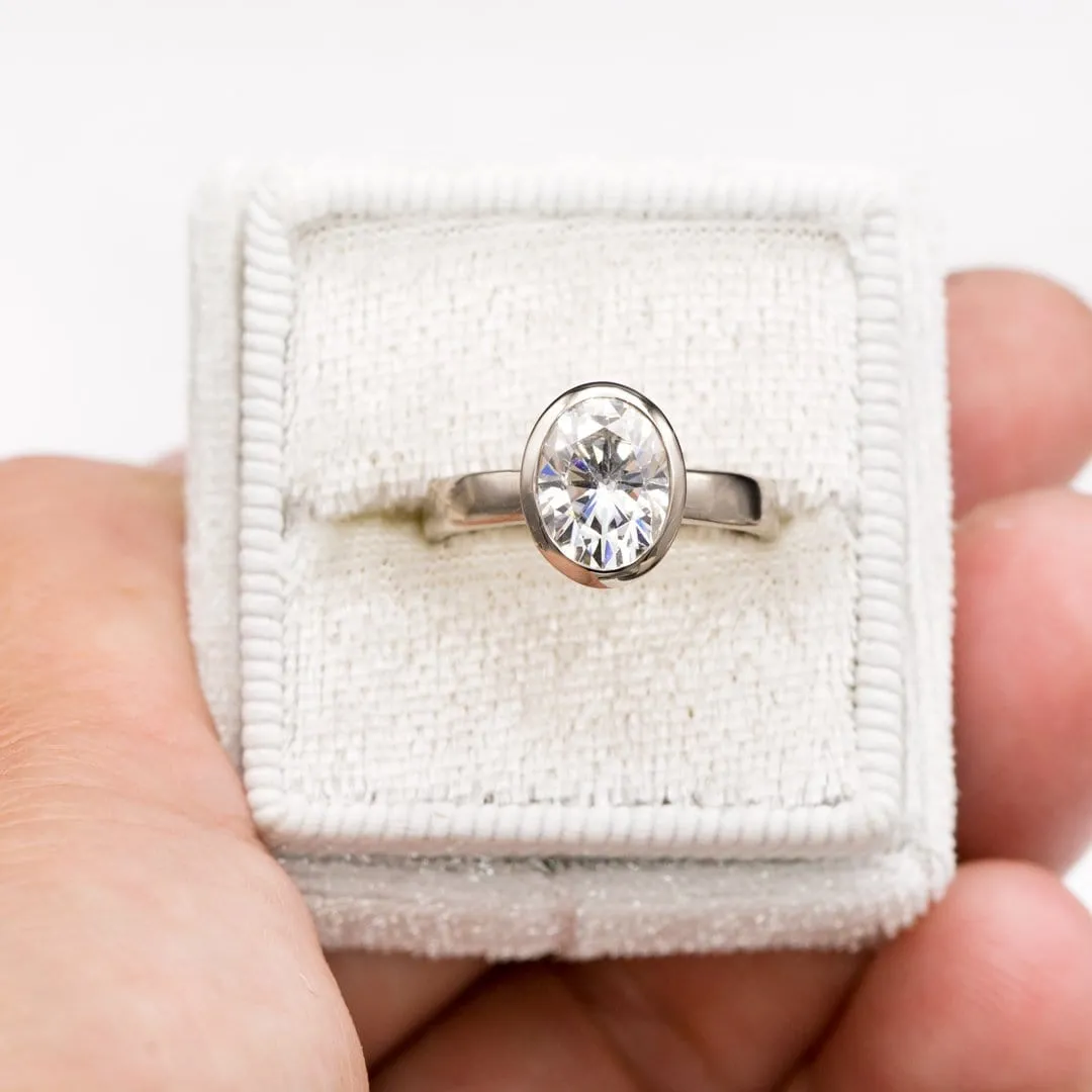 Oval Moissanite Peekaboo Bezel Solitaire Engagement Ring